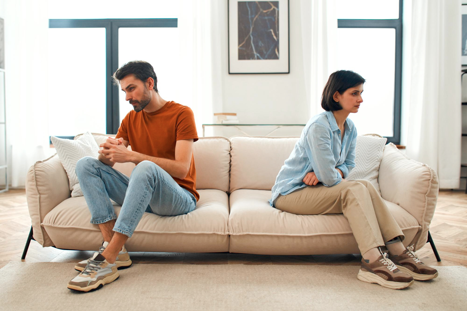 unhappy sad couple sitting apart couch living room after quarrel frustrated man woman turning their back ignoring having conflict home can find compromise misunderstanding concept